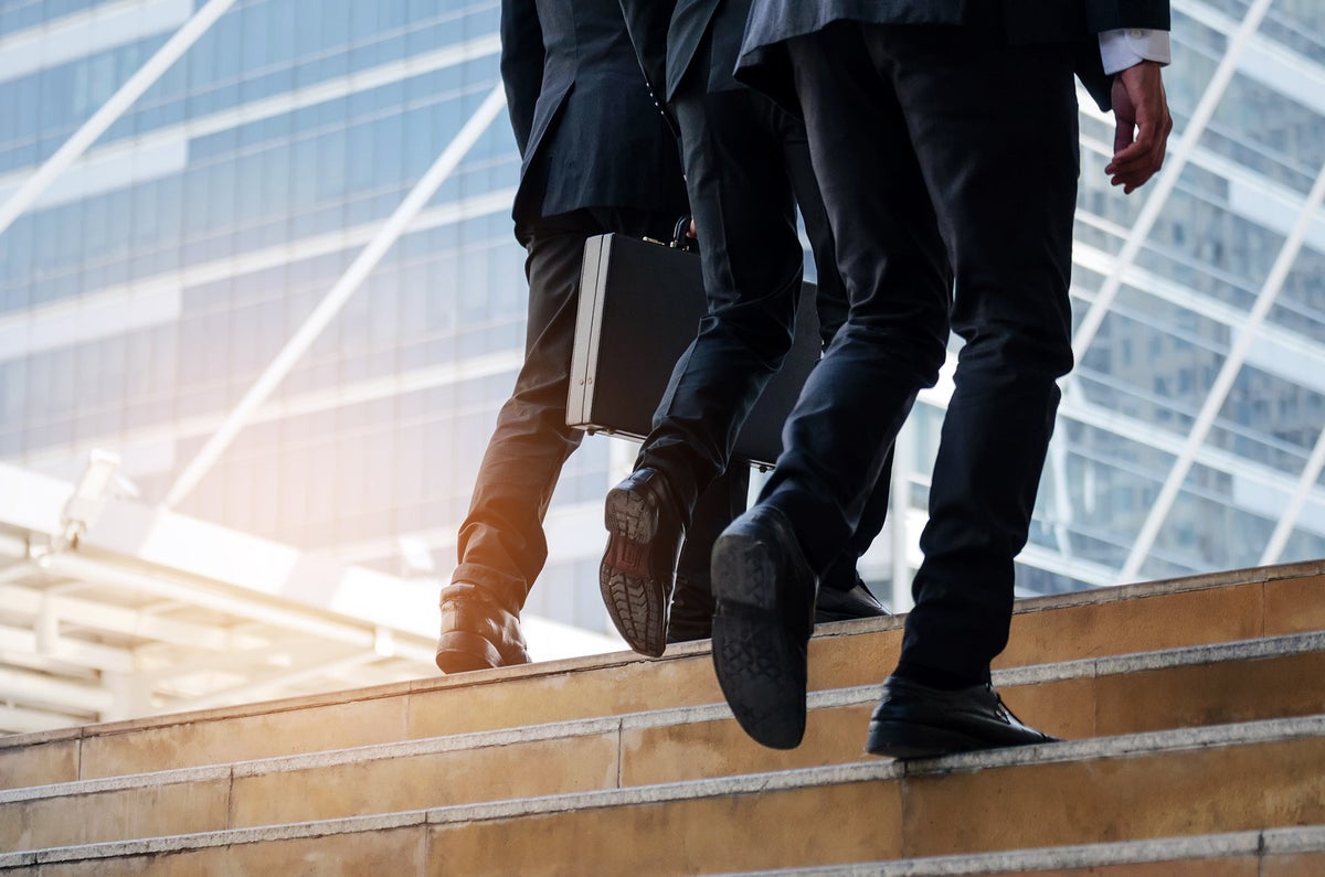 Business men walking up a flight of stairs
