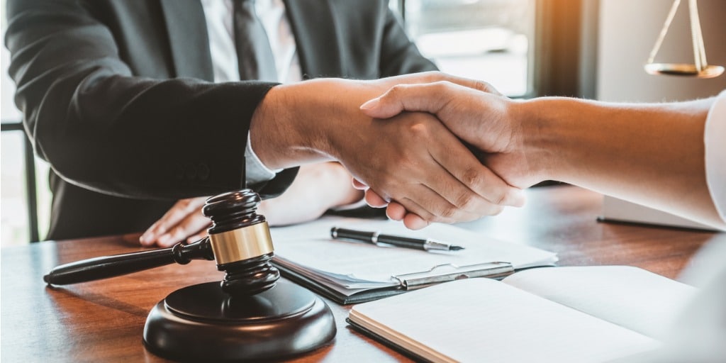 businessman shaking hands to seal a deal judges male lawyers legal