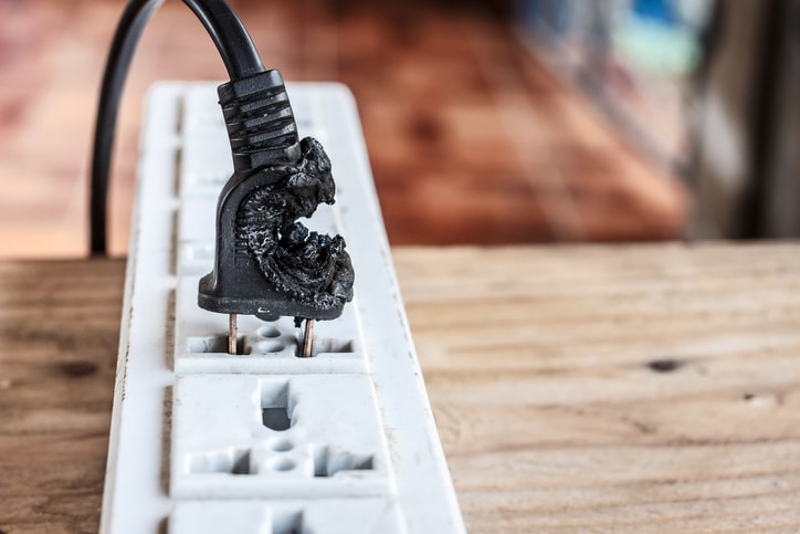 A melted electrical plug in a surge protector.