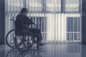 sad elderly man in wheelchair 300x200 2