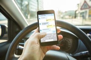 texting while driving, a common cause of car accidents